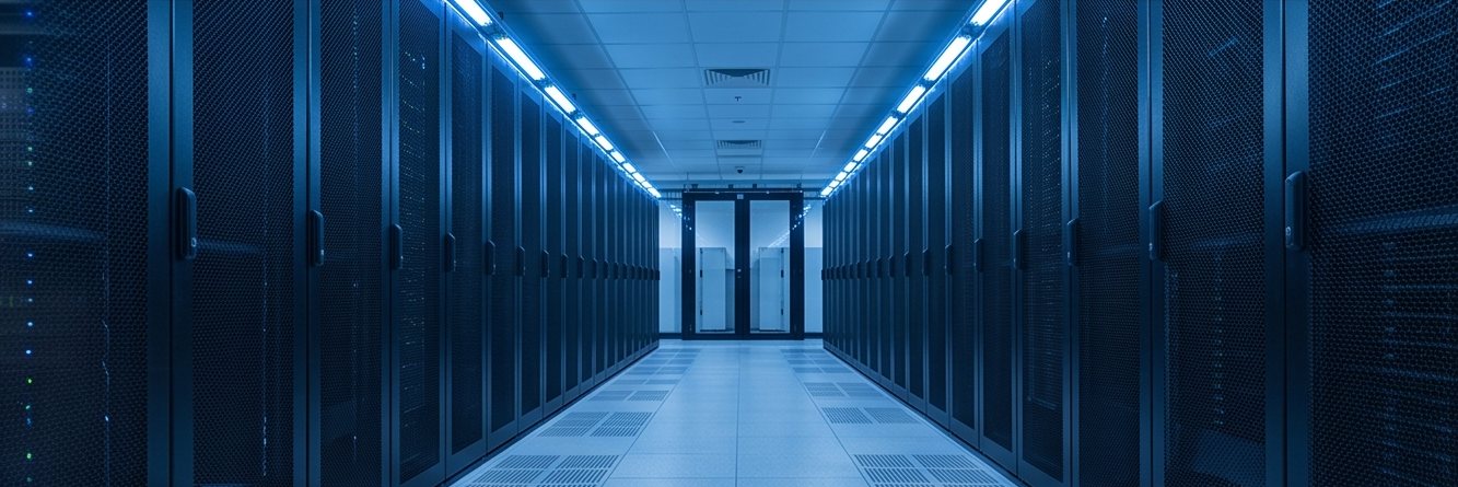 A corridor of server racks in a data centre